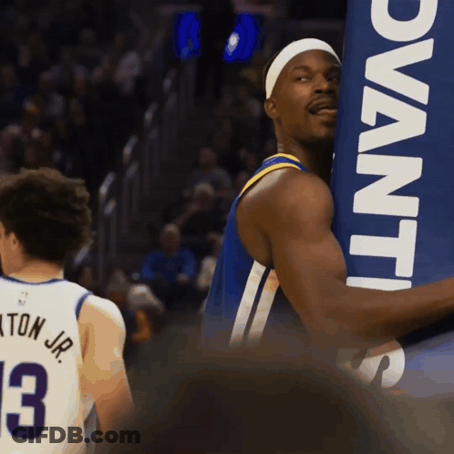A Basketball Player Wearing A Jersey With The Number 3 GIF