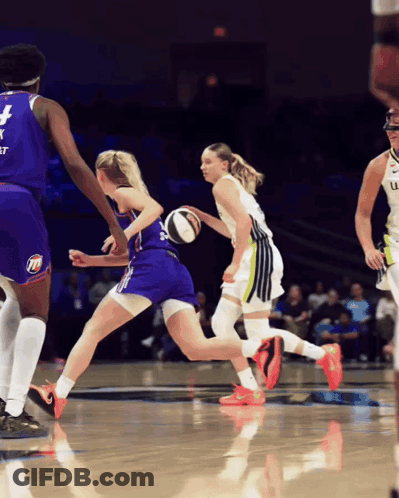 A Basketball Player Wearing A Jersey With The Number 4 On It Is Dribbling The Ball GIF