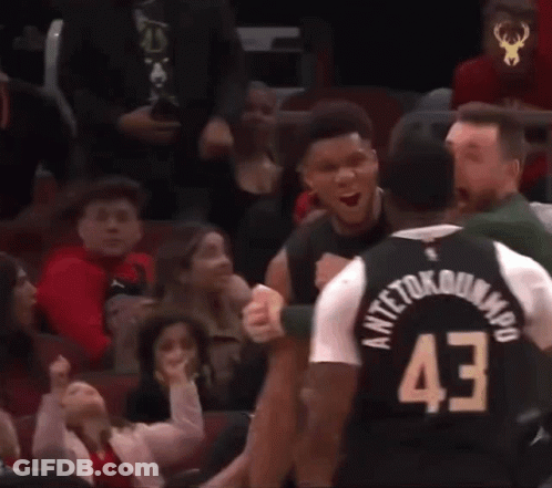 A Basketball Player Wearing A Jersey With The Number 43 On It Is Talking To Another Player . GIF