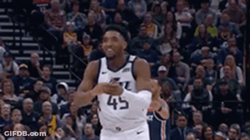 A Basketball Player Wearing A Jersey With The Number 45 On It GIF