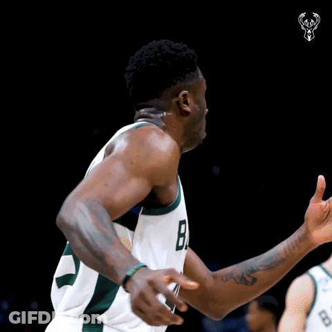 A Basketball Player Wearing A Jersey With The Number 8 On It GIF
