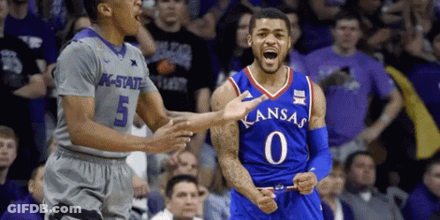 A Basketball Player Wearing A Kansas Jersey Celebrates With His Teammates GIF