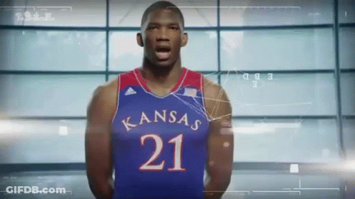 A Basketball Player Wearing A Kansas Jersey With The Number 21 On It GIF