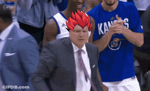 A Basketball Player Wearing A Kansas Shirt Applauds A Coach GIF