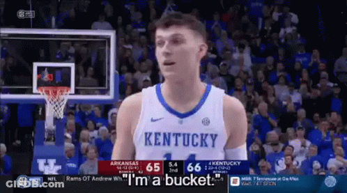 A Basketball Player Wearing A Kentucky Jersey Is Talking To The Crowd During A Game . GIF