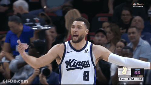 A Basketball Player Wearing A Kings Jersey Celebrates During A Game GIF
