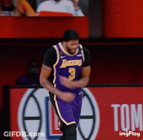 A Basketball Player Wearing A Lakers Jersey Is Dancing On The Court GIF