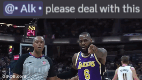 A Basketball Player Wearing A Lakers Jersey Is Pointing At The Camera GIF