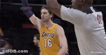 A Basketball Player Wearing A Lakers Jersey Is Reaching For The Ball GIF