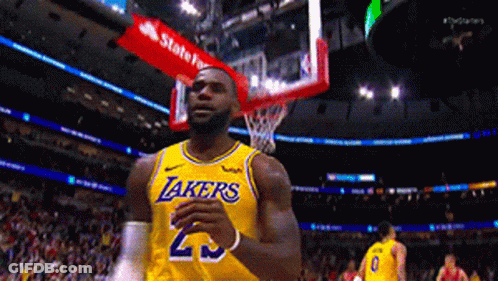 A Basketball Player Wearing A Lakers Jersey Is Standing In Front Of A Basketball Hoop GIF