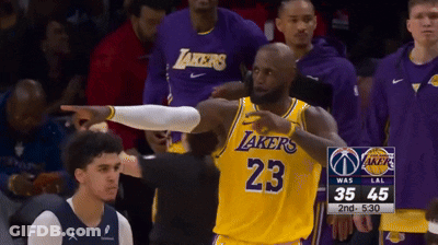 A Basketball Player Wearing A Lakers Jersey Points At Someone GIF