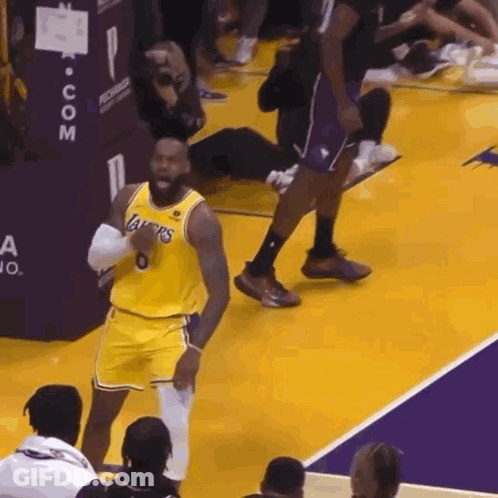 A Basketball Player Wearing A Lakers Jersey Stands On A Court GIF
