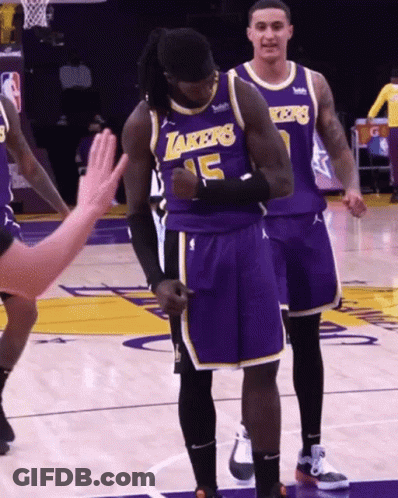 A Basketball Player Wearing A Lakers Jersey Stands On The Court GIF