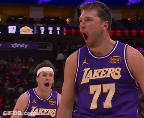 A Basketball Player Wearing A Lakers Jersey Stands With His Mouth Open GIF