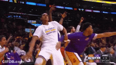 A Basketball Player Wearing A Los Angeles T-Shirt Is Jumping In The Air GIF
