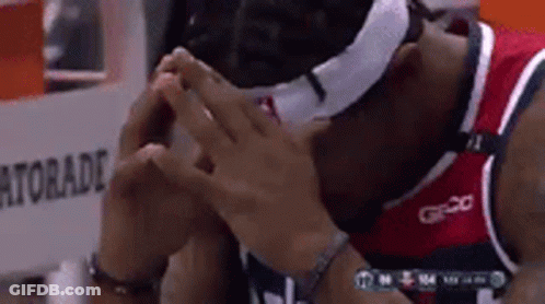 A Basketball Player Wearing A Mask And A Gatorade Bottle In The Background GIF