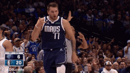 A Basketball Player Wearing A Maus 77 Jersey Is Giving A Thumbs Up GIF