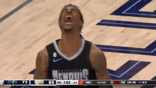 A Basketball Player Wearing A Memphis Jersey Is Screaming GIF