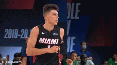 A Basketball Player Wearing A Miami Jersey Is Running On The Court GIF