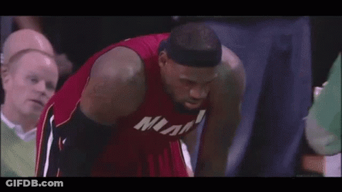 A Basketball Player Wearing A Miami Jersey Looks Down GIF