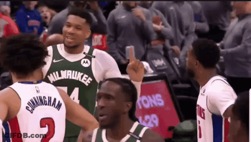 A Basketball Player Wearing A Milwaukee Jersey Is Giving The Middle Finger GIF