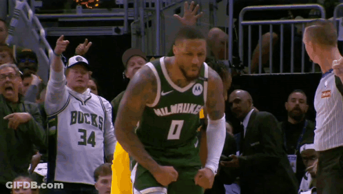 A Basketball Player Wearing A Milwaukee Jersey GIF