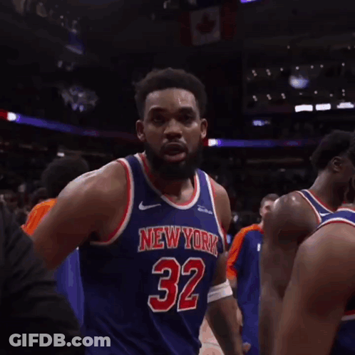 A Basketball Player Wearing A New York Jersey Giving The Middle Finger GIF