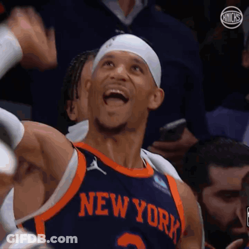 A Basketball Player Wearing A New York Jersey GIF