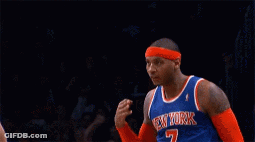 A Basketball Player Wearing A New York Jersey Is Making A Gesture . GIF