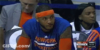 A Basketball Player Wearing A New York Jersey Sits On The Sidelines GIF