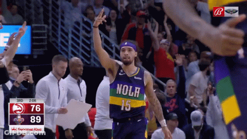 A Basketball Player Wearing A Nolr Jersey Stands In Front Of A Crowd GIF