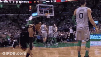 A Basketball Player Wearing A Number 0 Jersey Is Kneeling On The Court . GIF