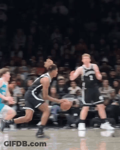 A Basketball Player Wearing A Number 1 Jersey Dribbles The Ball GIF