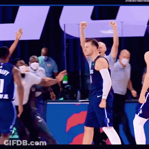 A Basketball Player Wearing A Number 1 Jersey Stands With His Fist In The Air GIF