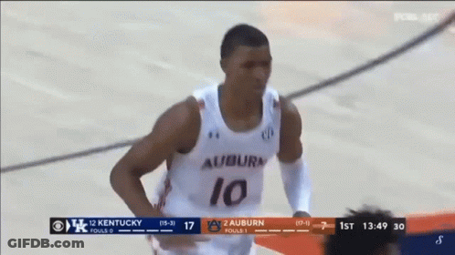 A Basketball Player Wearing A Number 10 Jersey Is Running On The Court GIF