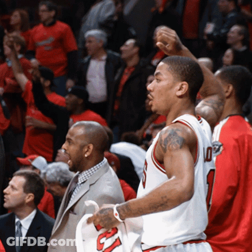 A Basketball Player Wearing A Number 10 Jersey Stands In Front Of A Crowd GIF