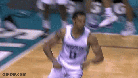 A Basketball Player Wearing A Number 11 Jersey Is Dancing On The Court GIF