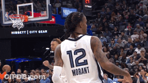 A Basketball Player Wearing A Number 12 Jersey GIF
