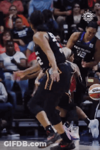 A Basketball Player Wearing A Number 12 Jersey GIF