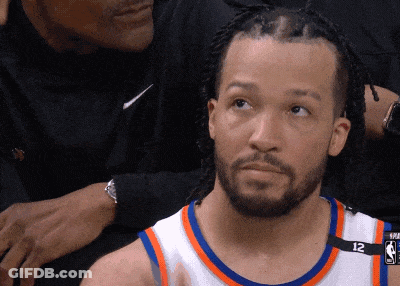 A Basketball Player Wearing A Number 12 Jersey GIF