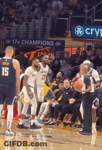 A Basketball Player Wearing A Number 15 Jersey Stands On The Court GIF