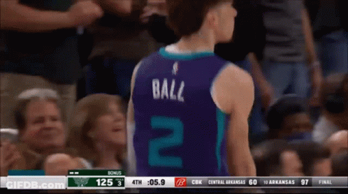 A Basketball Player Wearing A Number 2 Jersey Stands In Front Of A Crowd GIF