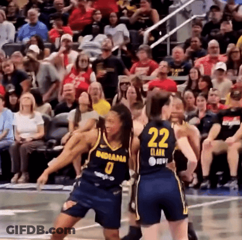 A Basketball Player Wearing A Number 22 Jersey Stands Next To Another Player GIF