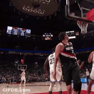 A Basketball Player Wearing A Number 23 Jersey Stands On The Court GIF