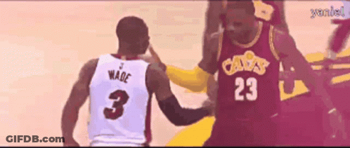 A Basketball Player Wearing A Number 23 Jersey Talks To Another Player Wearing A Number 3 Jersey GIF