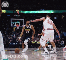 A Basketball Player Wearing A Number 27 Jersey Dribbles The Ball GIF
