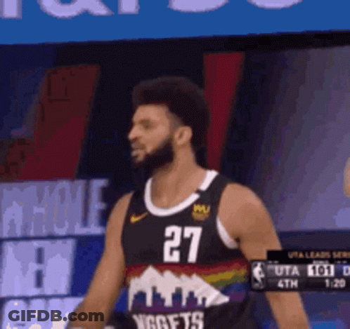 A Basketball Player Wearing A Number 27 Jersey Is Standing On The Court GIF
