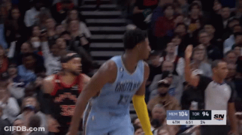 A Basketball Player Wearing A Number 29 Jersey Stands In Front Of A Crowd GIF