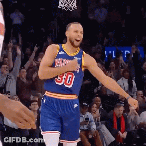 A Basketball Player Wearing A Number 30 Jersey Is Celebrating GIF