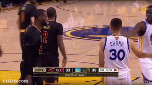 A Basketball Player Wearing A Number 30 Jersey Talks To Another Player GIF